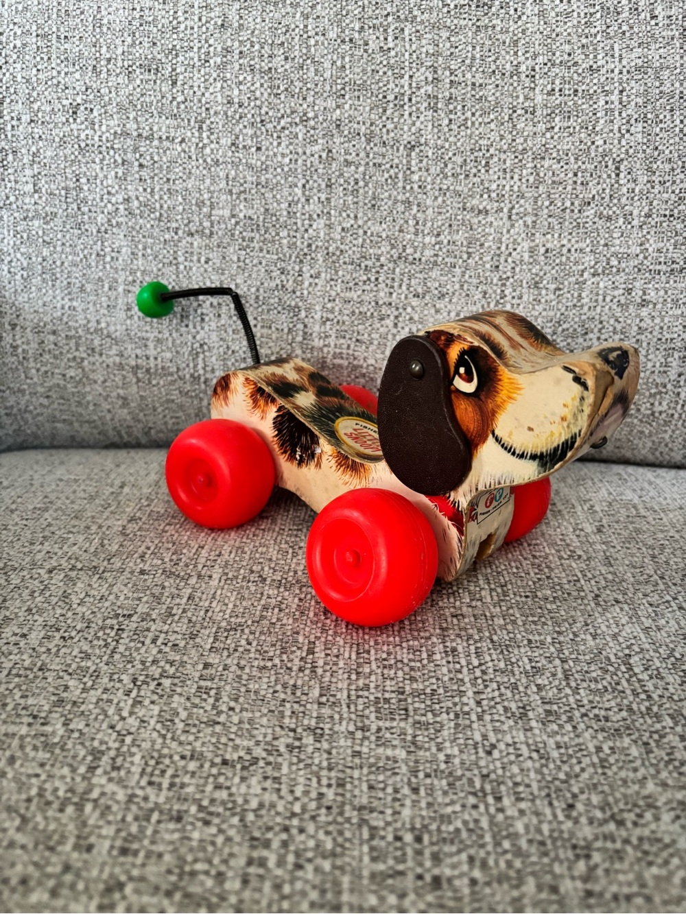 Vintage Pull-Along Dog Toy with Red Wheels